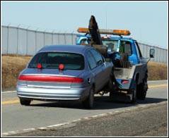 Image of car being towed away